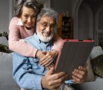 smiley-senior-people-with-tablet-low-angle