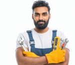A skilled Indian technician confidently holds various tools while showcasing his expertise in a professional portrait, embodying dedication and readiness for any task.